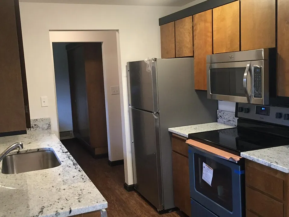 Kitchen looking into washer/dryer room