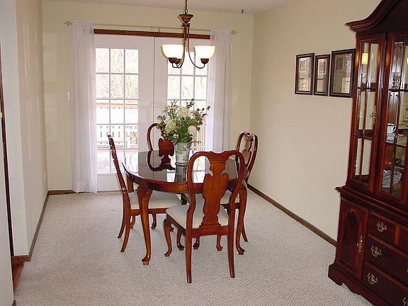 Formal dining rm. with patio door leading to two tier deck.