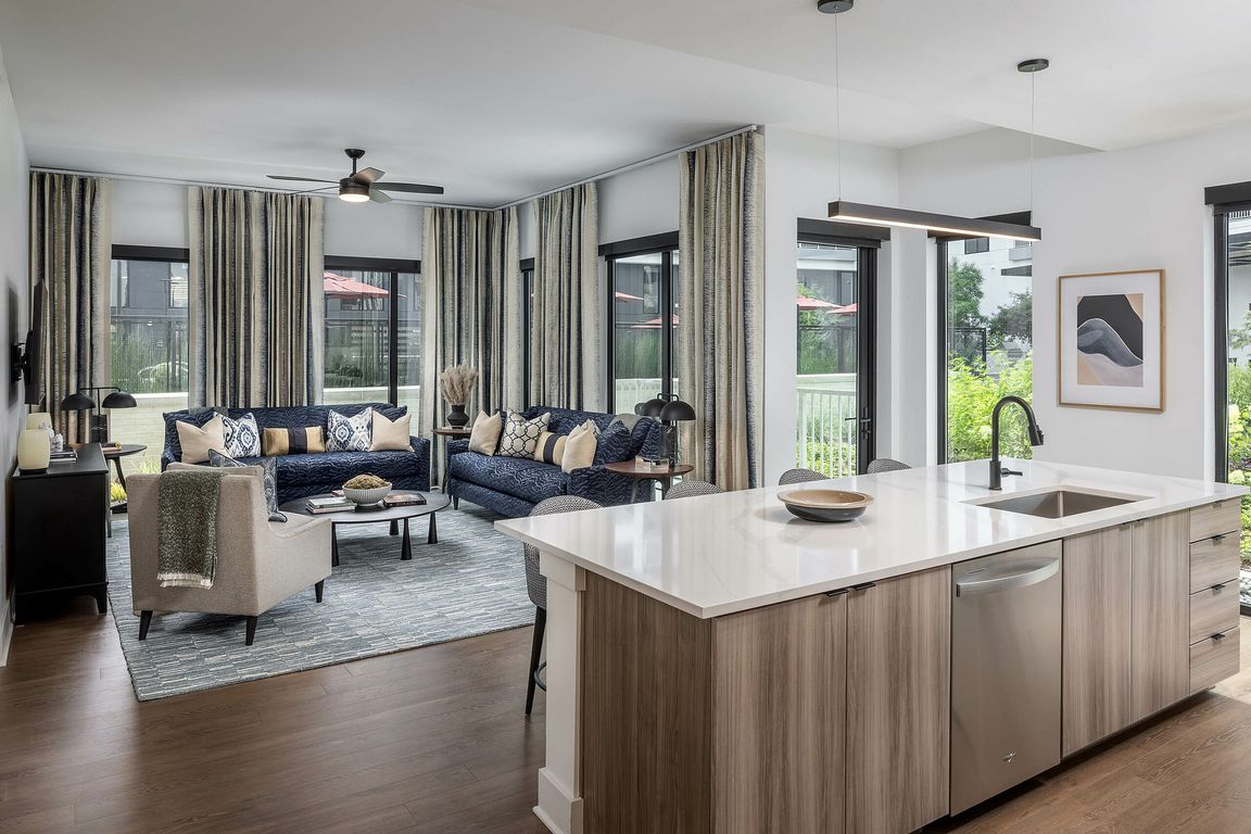 Open floorplan living room with Kember_ wood-style floors
