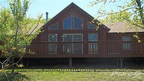Front view of the cedar sided home. The beautiful windows will let you watch all the seasons go by!!!