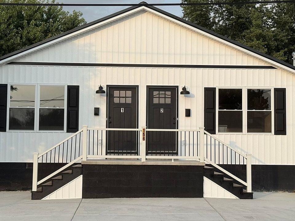 Spacious private front parking with one dedicated off-street parking space for each unit, convenient front-door access, attractive front porch, and energy-efficient LED exterior lighting for added visibility and convenience.