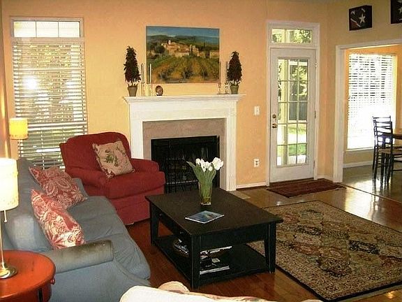 Family Room With Fireplace and Hardwood Flooring