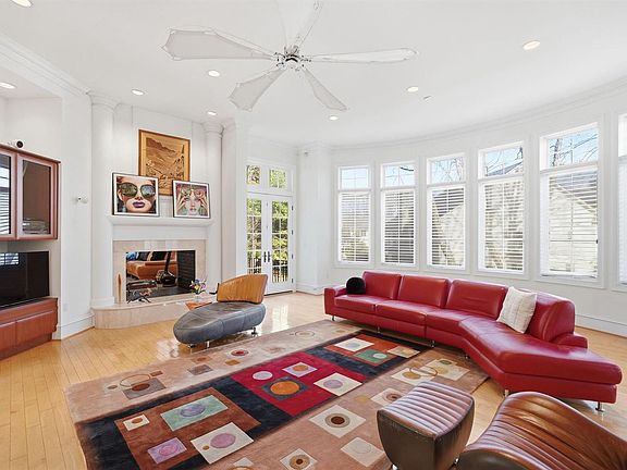 Family room with fireplace adjacent to kitchen.