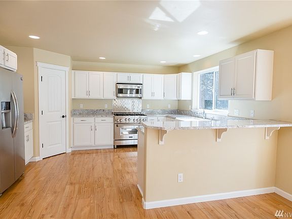 Open concept, kitchen flows into open eating space and living room