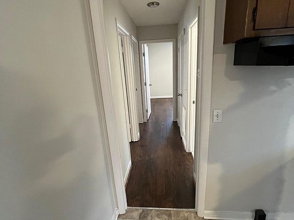 standing in the kitchen, looking down the hallway to the 3 BR and bath - typical ranch layout