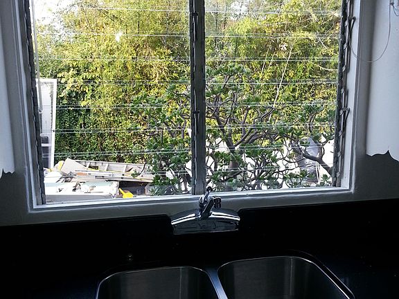 View from kitchen window to the shared courtyard.