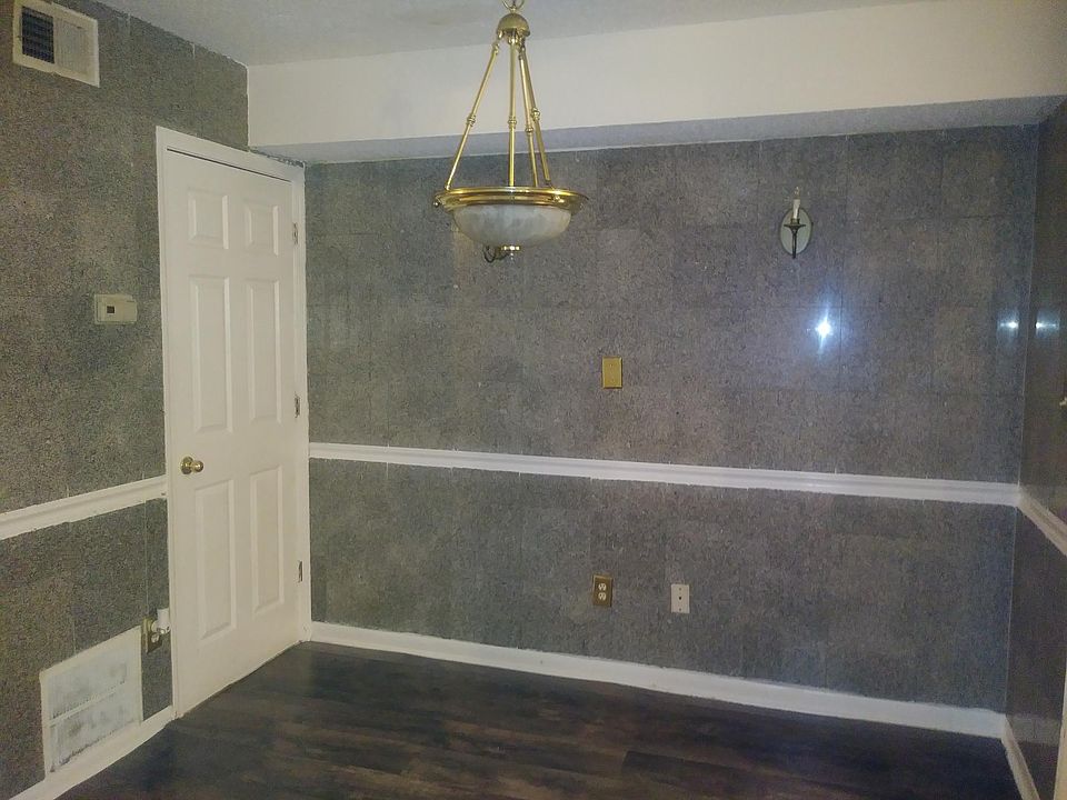 Dining room with beautiful lighting and granite walls