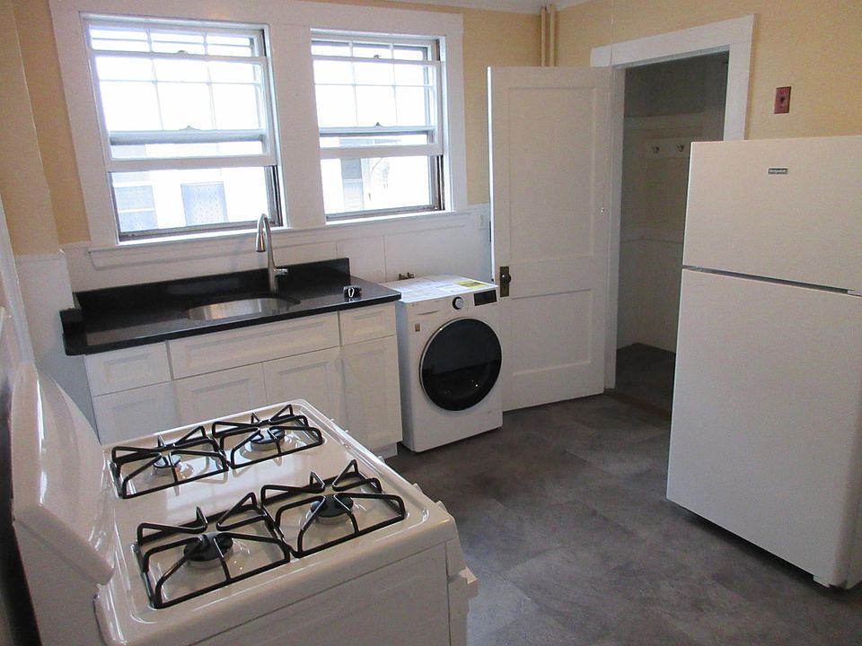 kitchen, new applicances-- gas stove, washing machine, refrigerator, new granite countertop, sink, faucet and sink cabinet. New floor