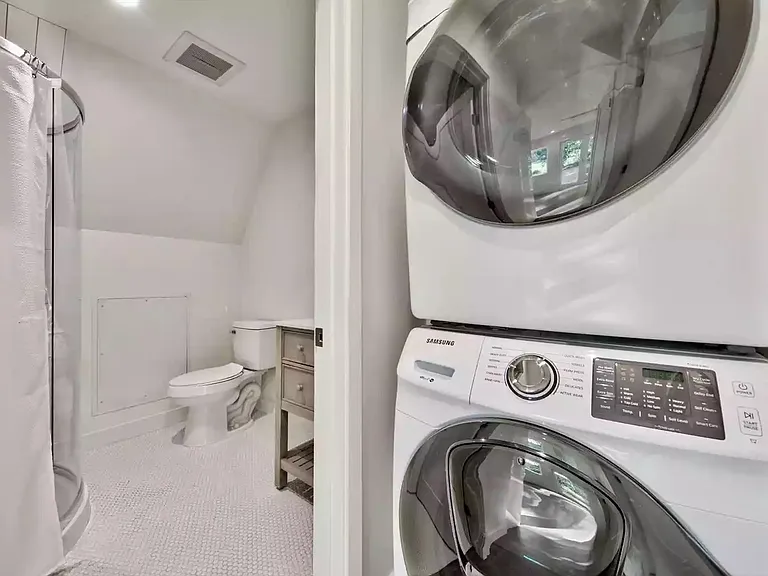 Washer and dryer outside of bathroom