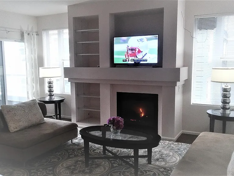 living room with living room set; Balcony access from living room.