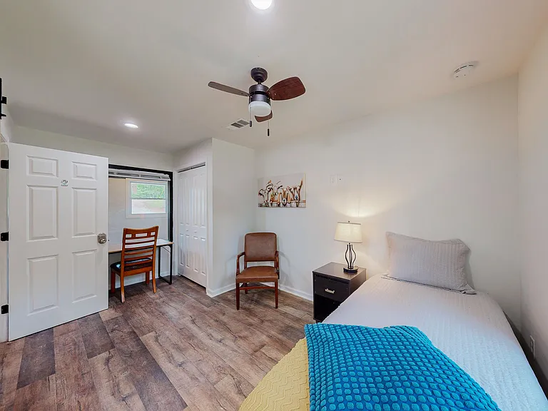 The room includes a full-size bed, not the smaller one pictured here.