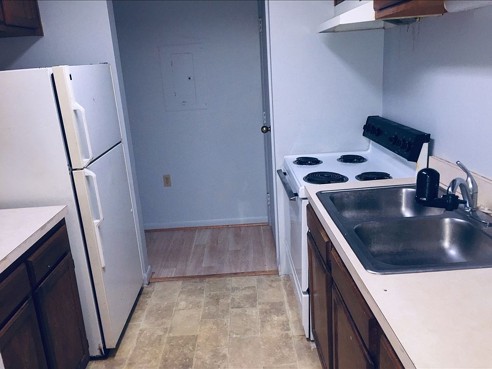 View of the kitchen from the entry foyer, through to the hallway to the bedroom and bath. Electric panel is straight ahead.