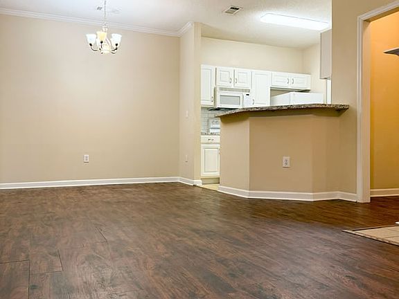 Open floor plan with dining area flowing into kitchen.