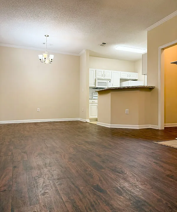 Open floor plan with dining area flowing into kitchen.