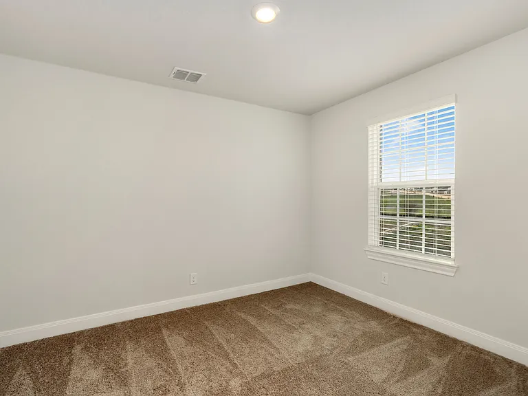 The additional bedrooms have lush carpet flooring.
