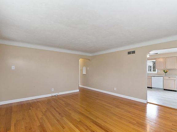 View into Eat-In Kitchen and hallway to bedrooms.