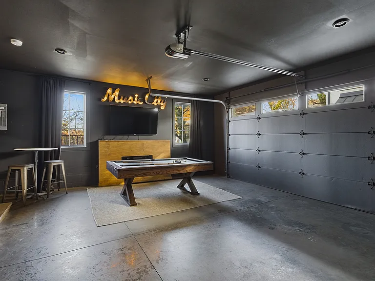 Pool table, darts and smart TV located in the garage! Still room for 1 car to park, or we can remove those items and you can use both sides of the garage to park in.