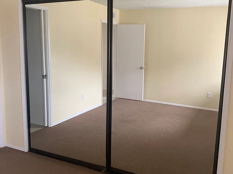Mirrored wardrobe doors.