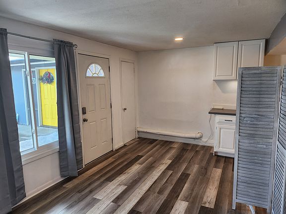 With movable room divider.