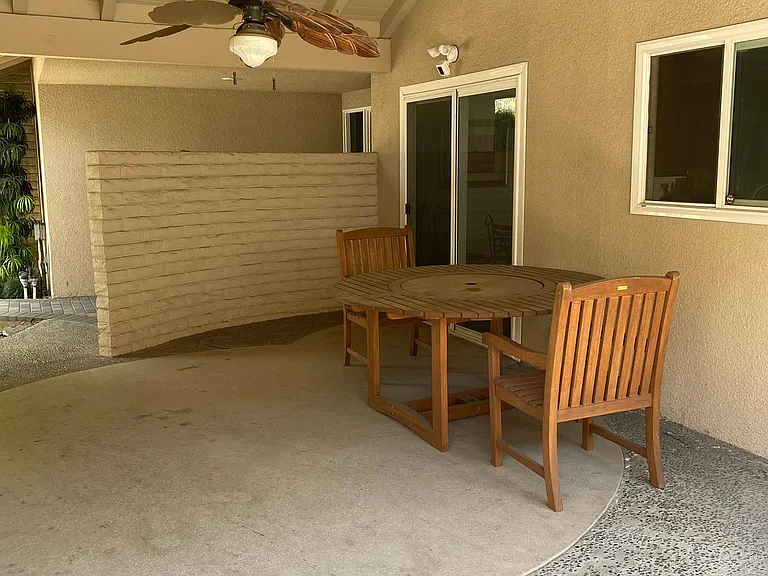 Large breezeway to the right of front door.