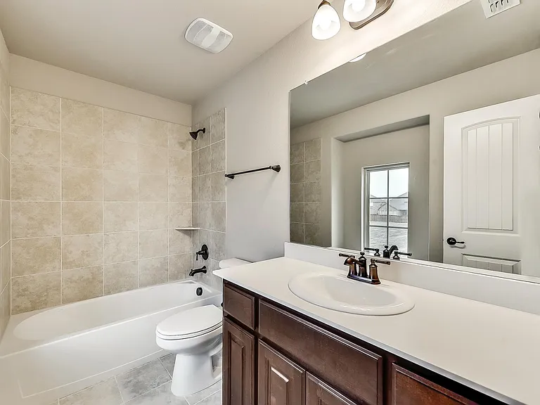 Private full bath with windows by bedroom #3 on second floor