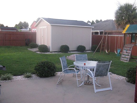Left side of back yard, large shed with power