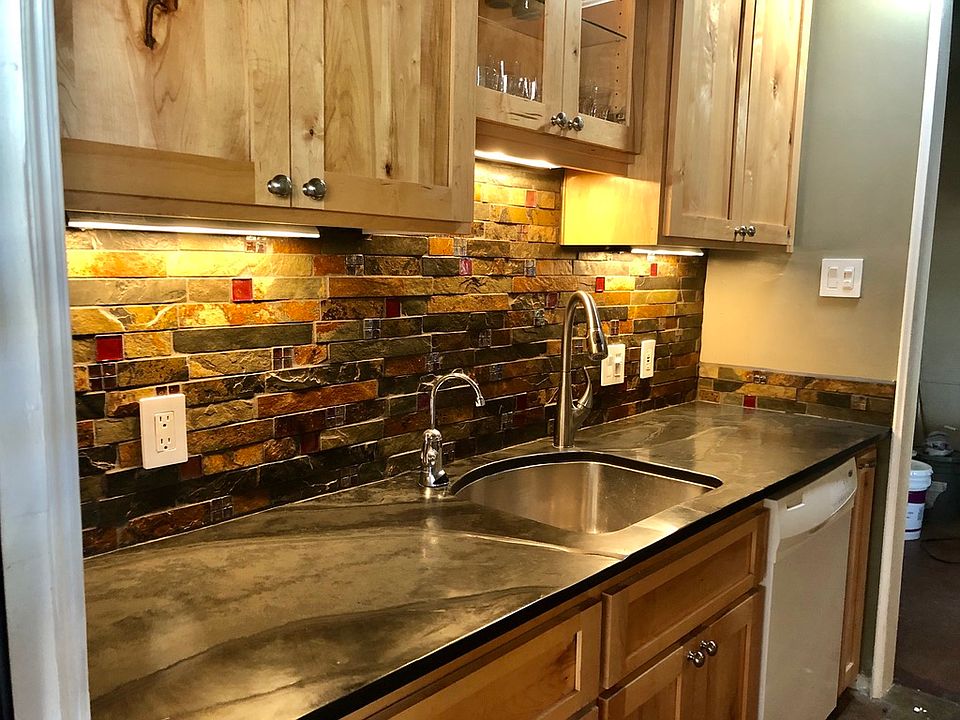Under counter lighting, Kitchen ceiling fan, extra Faucet for filtered water. Custom ordered slate and glass backslash, Slate kitchen floors.