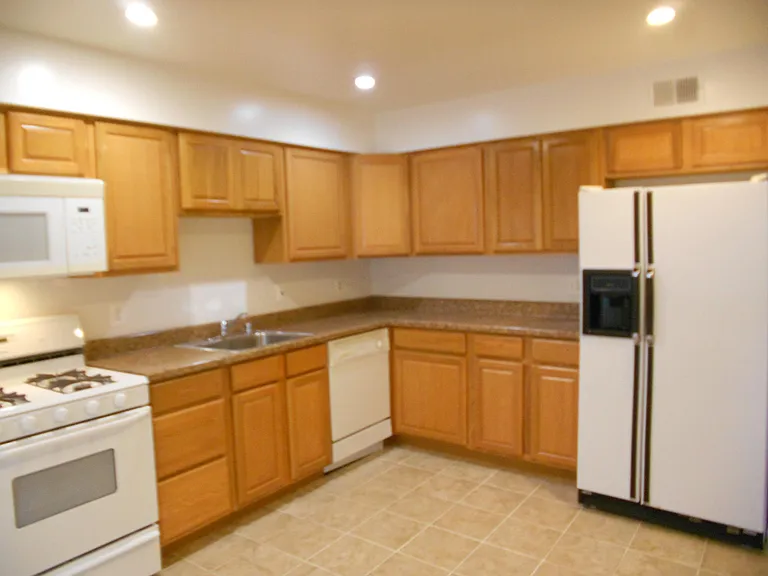Updated Kitchen with plenty of cabinets, gas stove, newer Refrigerator.