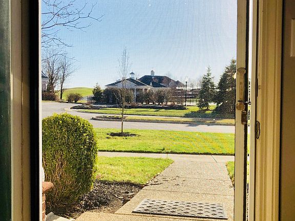 Front Door View (with Phantom Screens!) Pool/Country Club directly across the street!