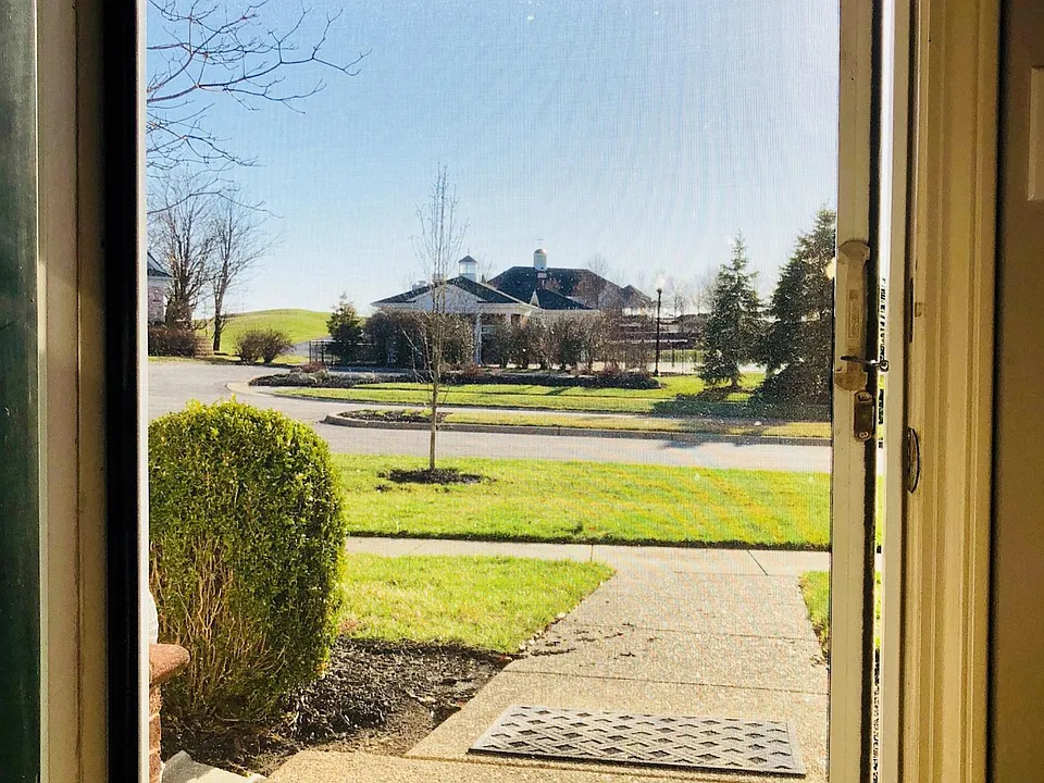 Front Door View (with Phantom Screens!) Pool/Country Club directly across the street!
