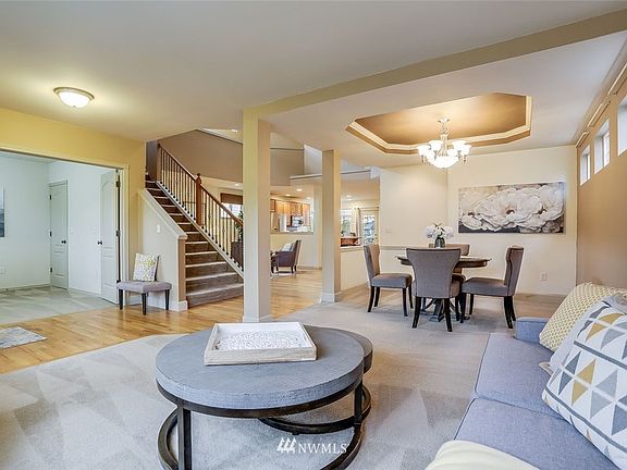 Open sight lines from living area to family room and formal dining area