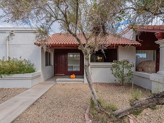 Lovely front patio with storage unit to the right.