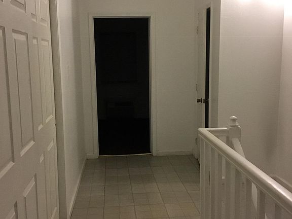 Upstairs stairwell with closets