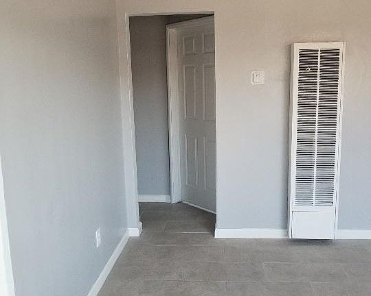 Part of living room to hallway and bedroom