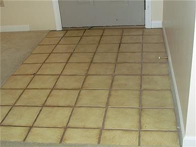 Tile Entry at Front Door to create a Small Foyer.