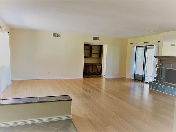 large living area connects to kitchen / dining