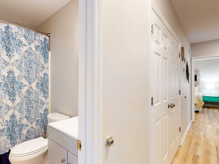 Shared Bath and view of laundry closet