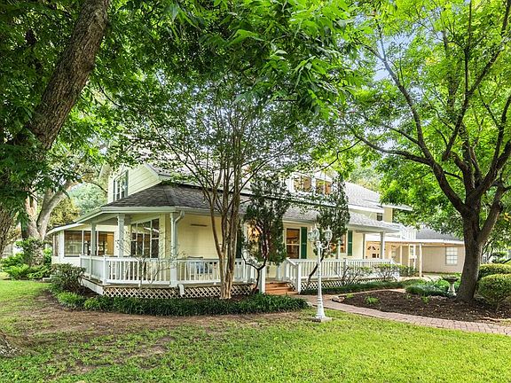 Mature Trees grace this property on a 14,026 sq. ft. corner lot overlooking iconic Oyster Creek.