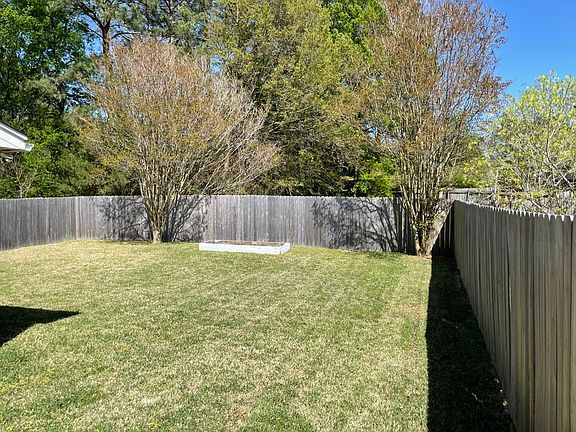Backyard with raised garden bed