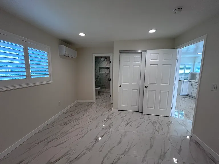 View from Bedroom 2: Bathroom 2 (left), kitchen area (right)