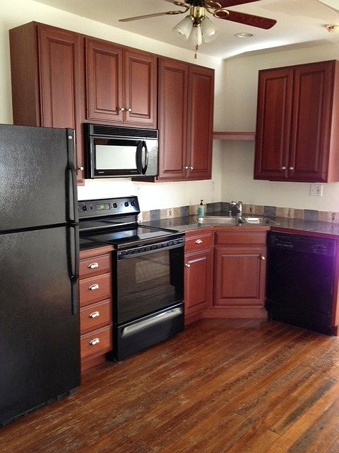 Beautiful chef's cherry kitchen with granite countertops