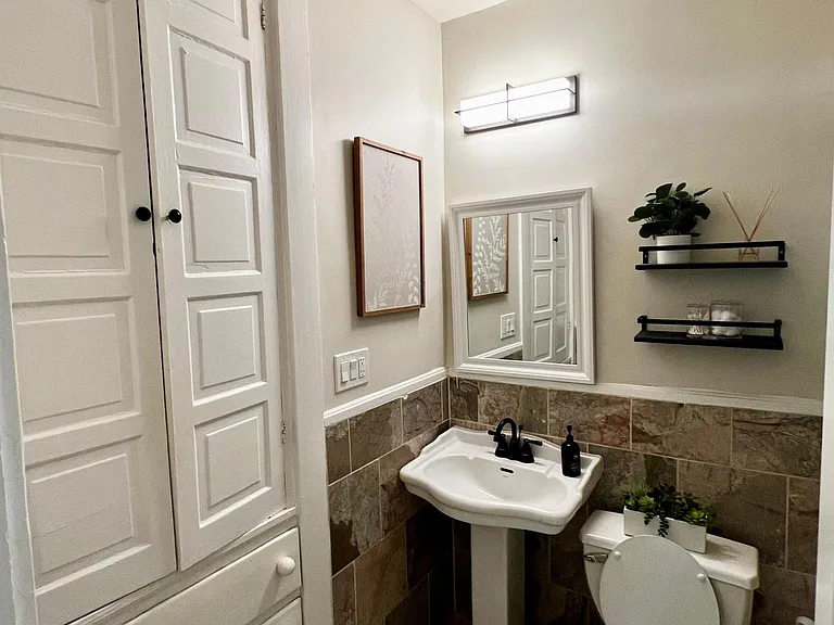 Floor to ceiling built-in storage in bathroom