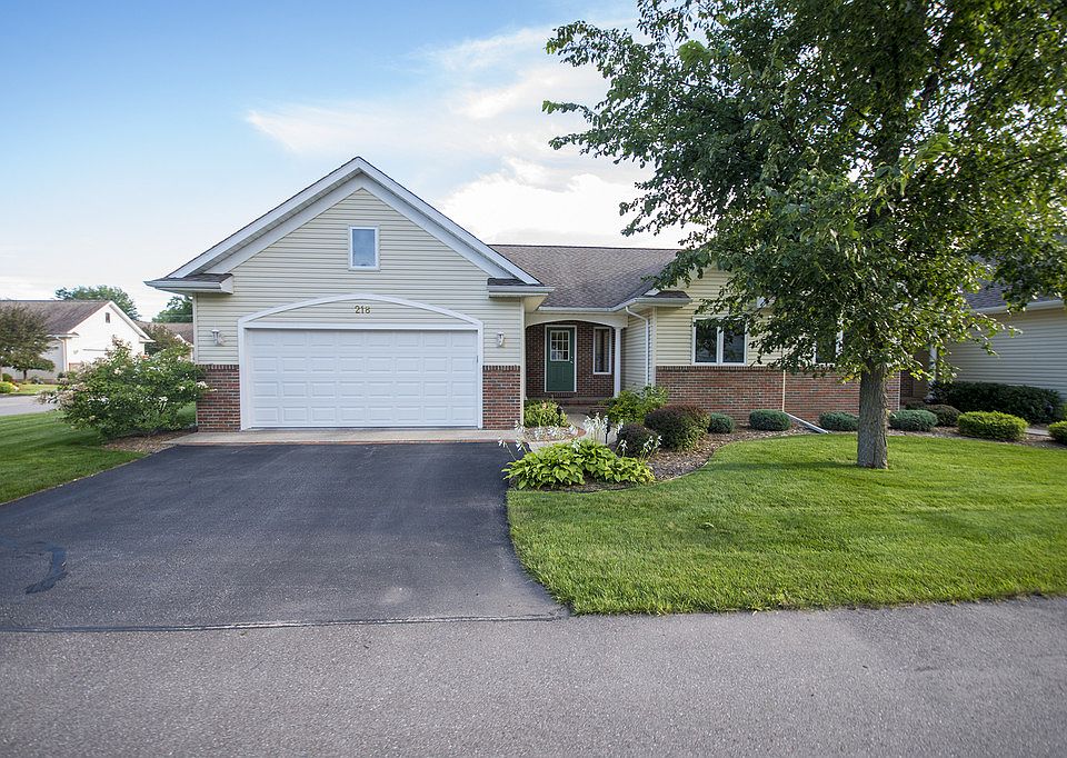 MADE FOR YOU IN MORNING MEADOW! This impeccably well-maintained and clean three bedroom, three full bathroom ranch style condominium features 1,331 square feet of luxurious living space with an open concept and fully finished basement nestled neatly on one of only four corner lots in the highly sought after Morning Meadow Condo Community. Granite counter tops and stainless steel appliances anchor the large galley style kitchen with island bar connecting to the living room and dining area. Natural light flows through the main level's skylights with vaulted ceilings. The home also features main floor laundry and main floor master bedroom with attached en suite with marble flooring and custom glass shower. Condo fees are $176 per month and include all lawn care, snow removal, and exterior building maintenance. Don't wait, call today for your own private showing!