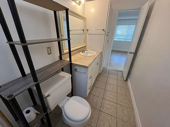 Spacious bathroom with lots of cabinets and drawers