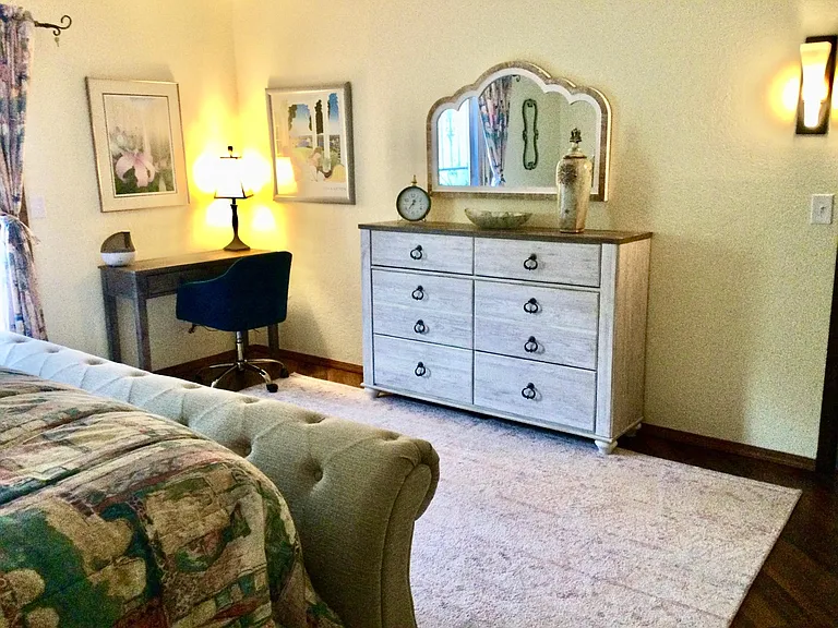 The master suite has a small writing desk and a comfy chair!