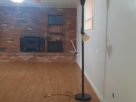 Spacious front room includes gas fireplace