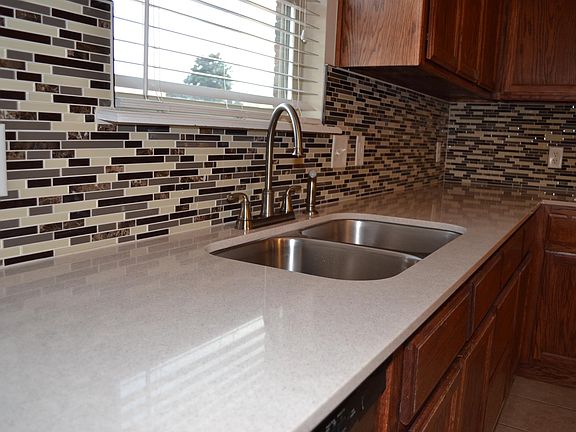 New quartz countertops with undercount sink and upgraded faucet
