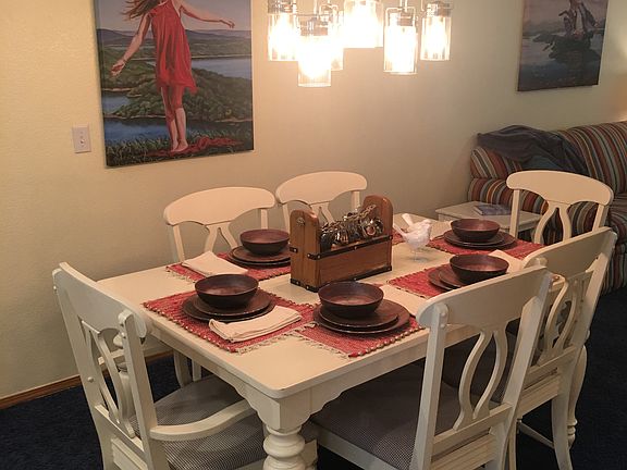 Dining table extends with extra leaves.