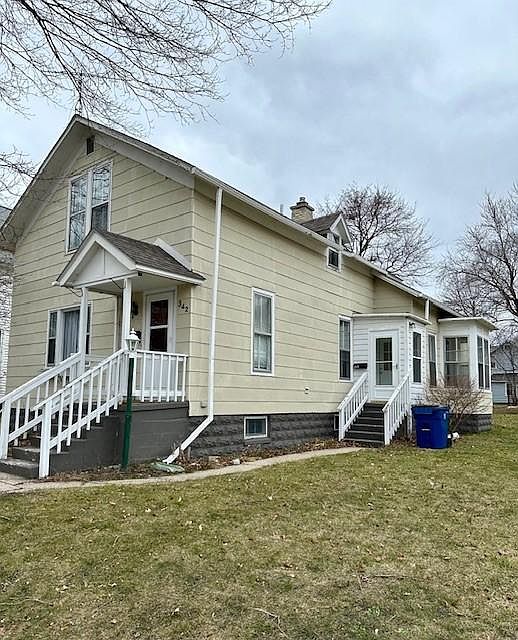 Exterior of Home showing side entrance to this unit. Entrance into unit is a couple steps inside the exterior door.