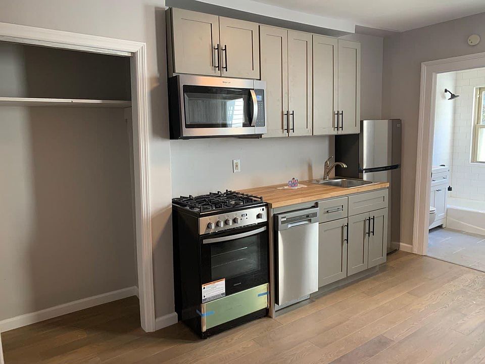 Newly renovated kitchen with stainless steel appliances and dishwasher. Ample pantry space.
